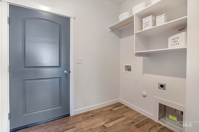 laundry area featuring hookup for an electric dryer, gas dryer hookup, dark hardwood / wood-style flooring, and hookup for a washing machine