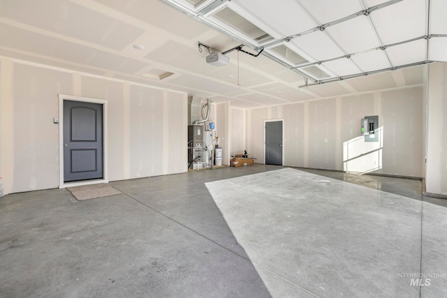 garage with electric panel and a garage door opener