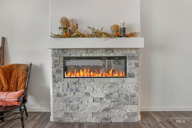 interior details with hardwood / wood-style flooring and a fireplace