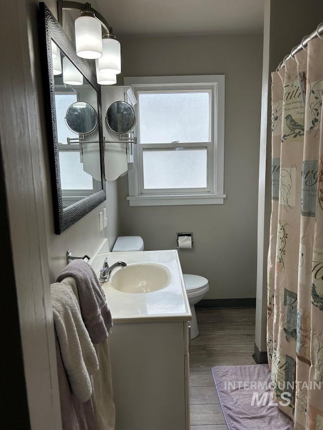 1527 13th Ave, Lewiston, ID 83501 - bathroom featuring vanity and wood finished floors