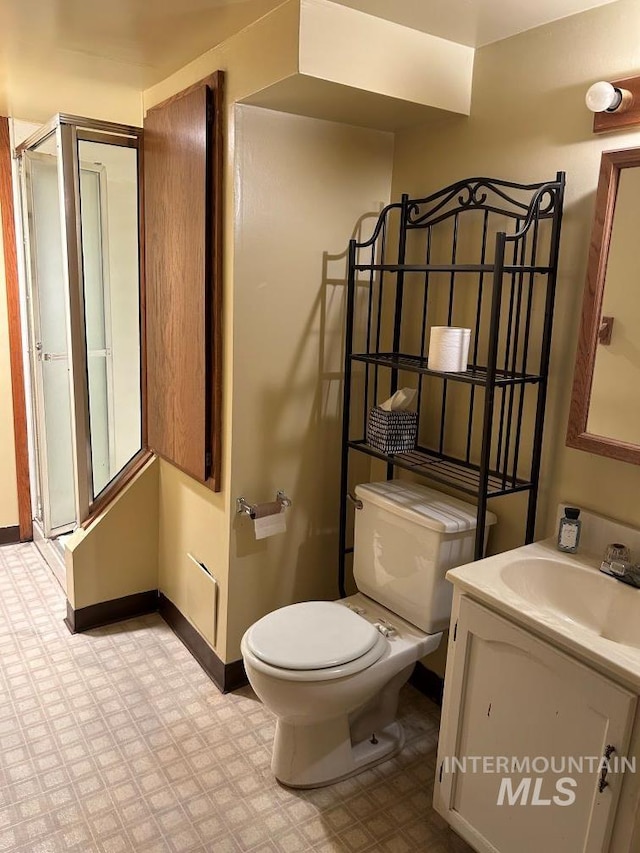 1527 13th Ave, Lewiston, ID 83501 - bathroom featuring vanity, tile patterned floors, and a shower with shower door