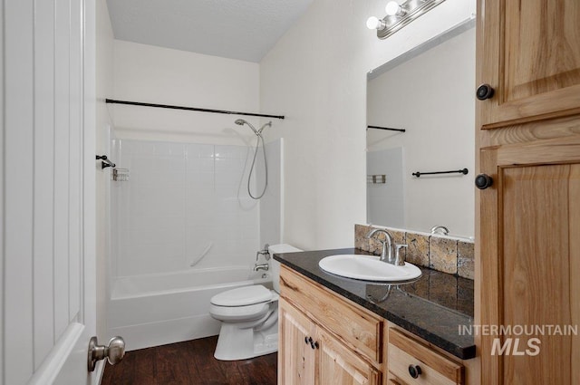 316 N 11th St, Payette, ID 83661 - bathroom featuring vanity, bathing tub / shower combination, and wood finished floors