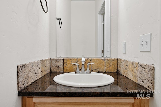 316 N 11th St, Payette, ID 83661 - bathroom with vanity and backsplash