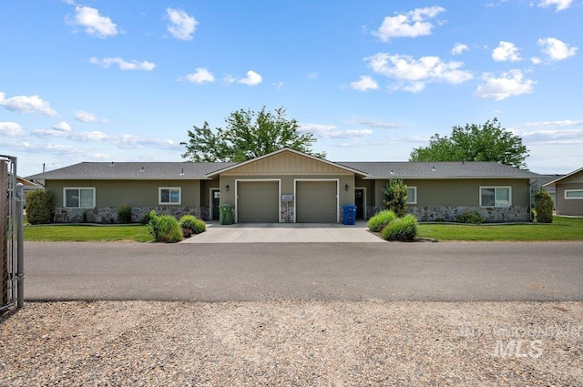 316 N 11th St, Payette, ID 83661 - ranch-style home featuring a garage, a front lawn, stone siding, and concrete driveway