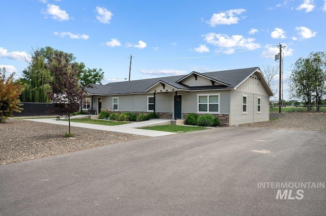 316 N 11th St, Payette, ID 83661 - view of front of home featuring stone siding and board and batten siding