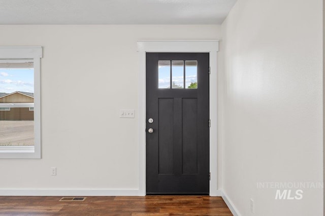 316 N 11th St, Payette, ID 83661 - entryway featuring baseboards and wood finished floors