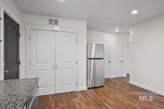316 N 11th St, Payette, ID 83661 - kitchen with freestanding refrigerator, dark wood finished floors, stone countertops, and recessed lighting