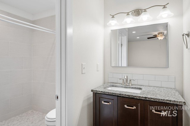316 N 11th St, Payette, ID 83661 - full bath with vanity, a tile shower, a ceiling fan, and tasteful backsplash