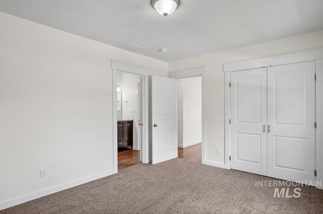 316 N 11th St, Payette, ID 83661 - unfurnished bedroom with carpet flooring, a closet, and a textured ceiling