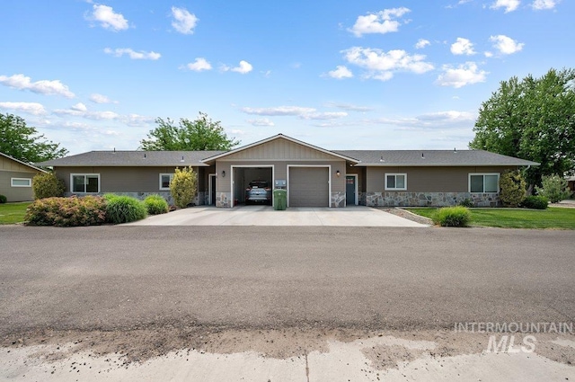 316 N 11th St, Payette, ID 83661 - single story home featuring stone siding, a garage, and driveway