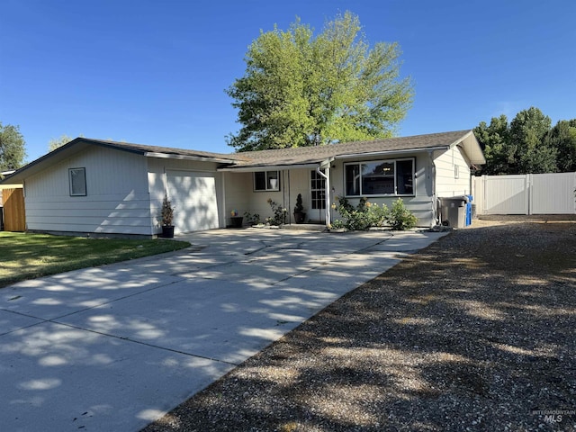 1514 Helena Dr, Caldwell, ID 83605 - single story home featuring a garage, driveway, and a gate