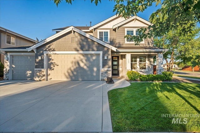 craftsman inspired home featuring a garage, stone siding, concrete driveway, and a front yard