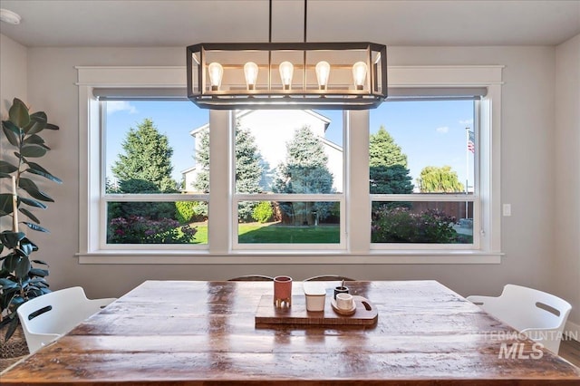 dining area featuring a chandelier