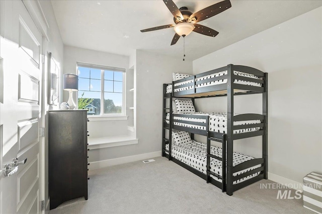 carpeted bedroom with baseboards