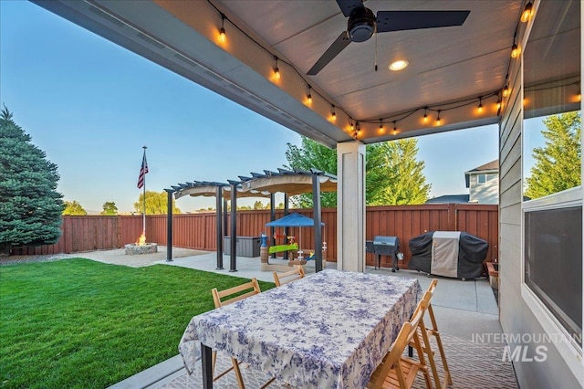 view of patio / terrace with ceiling fan, a fenced backyard, a fire pit, area for grilling, and a pergola