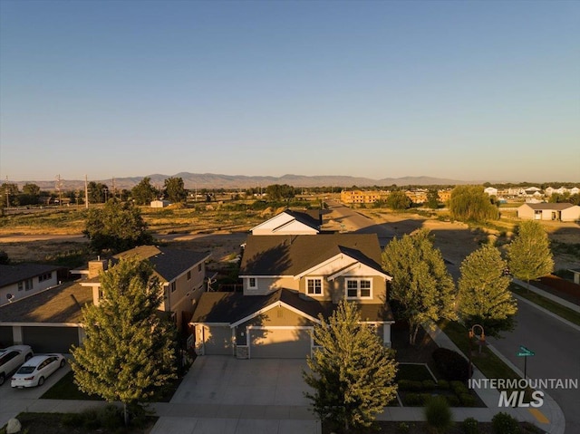 bird's eye view featuring a residential view and a mountain view