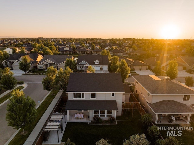 aerial view at dusk with a residential view