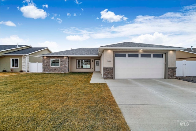 view of front of home featuring stone siding, an attached garage, fence, a front lawn, and stucco siding