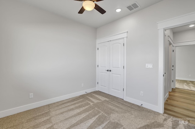 unfurnished bedroom with recessed lighting, visible vents, baseboards, a closet, and carpet