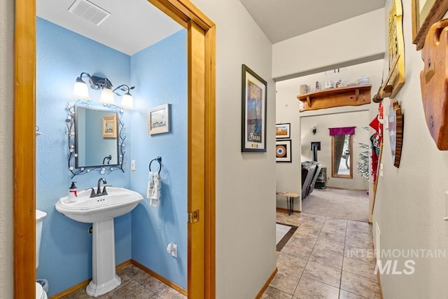 bathroom with sink and tile patterned floors