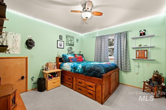 carpeted bedroom with ceiling fan