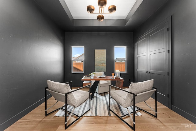 875 Creekwater, Eagle, ID 83616 - office with healthy amount of natural light, a raised ceiling, and light wood finished floors