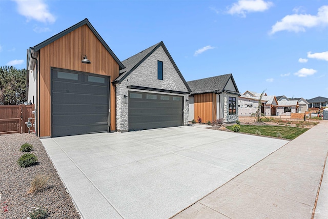 875 Creekwater, Eagle, ID 83616 - view of front of home with stone siding, an attached garage, concrete driveway, and board and batten siding