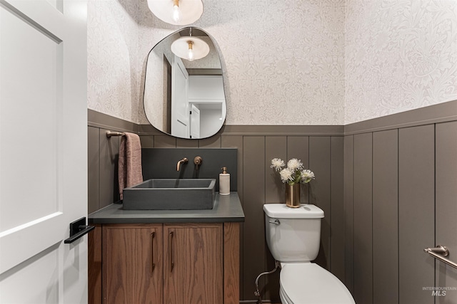 875 Creekwater, Eagle, ID 83616 - bathroom featuring wallpapered walls, wainscoting, vanity, and a decorative wall