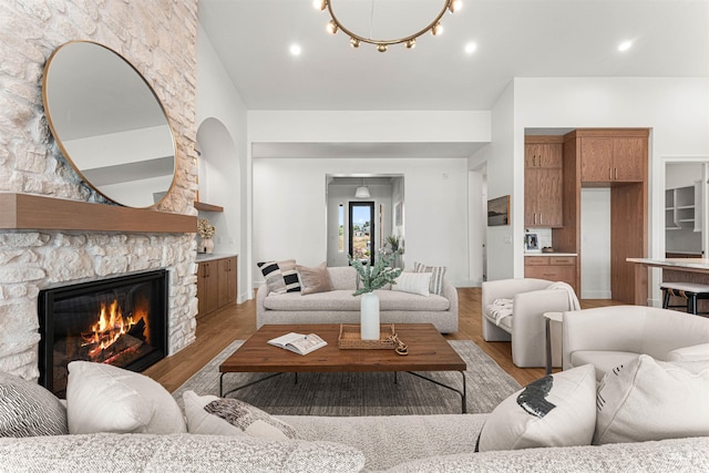 875 Creekwater, Eagle, ID 83616 - living room with a stone fireplace and light wood-style flooring