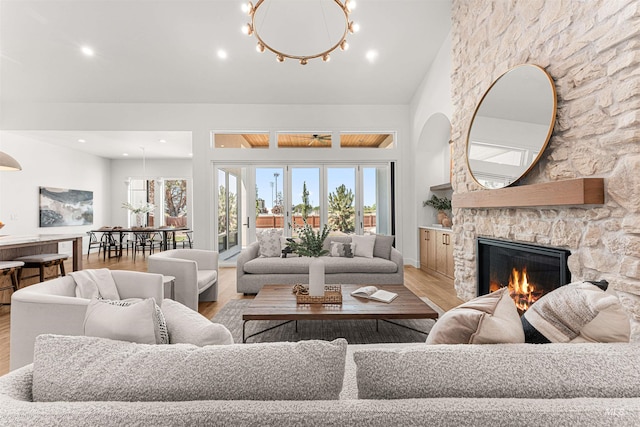 875 Creekwater, Eagle, ID 83616 - living area with light wood-style floors, a fireplace, plenty of natural light, recessed lighting, and vaulted ceiling