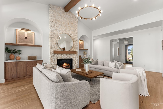 875 Creekwater, Eagle, ID 83616 - living area featuring beamed ceiling, a chandelier, a fireplace, light wood finished floors, and high vaulted ceiling