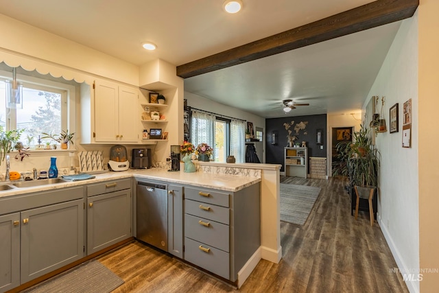 kitchen with stainless steel dishwasher, gray cabinets, and a wealth of natural light