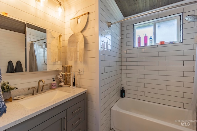 bathroom with vanity and shower / bath combo with shower curtain