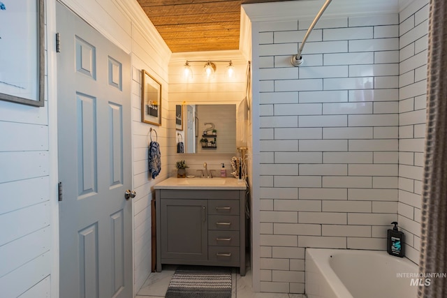 bathroom featuring vanity, tiled shower / bath, and wooden ceiling