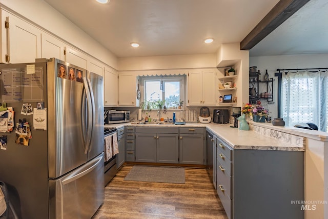 kitchen featuring white cabinets, gray cabinets, dark hardwood / wood-style flooring, and appliances with stainless steel finishes