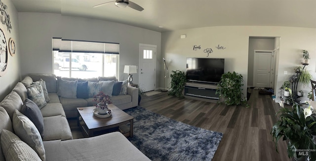 living room with wood finished floors and a ceiling fan