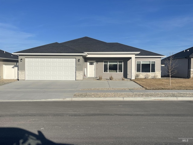 view of front of home featuring an attached garage and concrete driveway