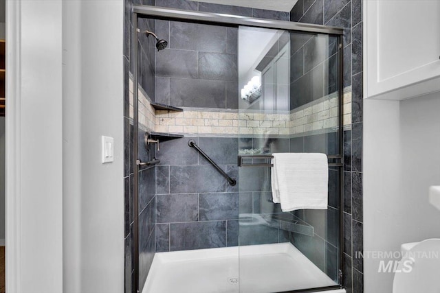 bathroom featuring a stall shower
