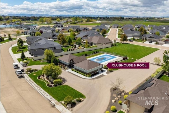birds eye view of property with a residential view