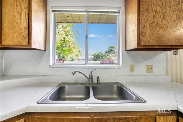 2011 Schodde, Burley, ID 83318 - kitchen with a sink, brown cabinets, light countertops, and plenty of natural light