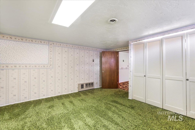 2011 Schodde, Burley, ID 83318 - unfurnished bedroom featuring carpet, a textured ceiling, and a closet