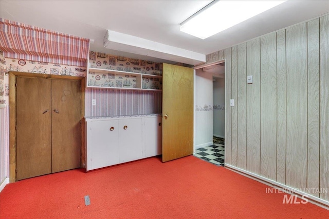 2011 Schodde, Burley, ID 83318 - unfurnished bedroom with wooden walls and carpet flooring