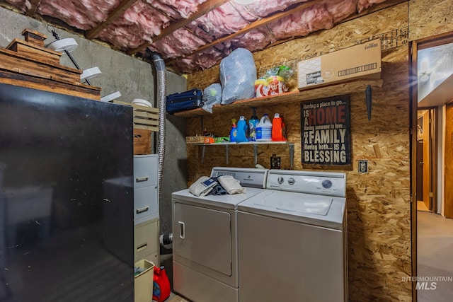 washroom featuring washing machine and dryer