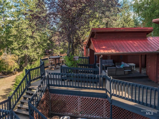 wooden deck featuring outdoor lounge area