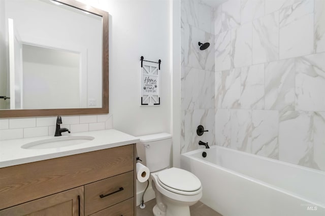 full bathroom featuring tasteful backsplash, vanity, toilet, and tiled shower / bath