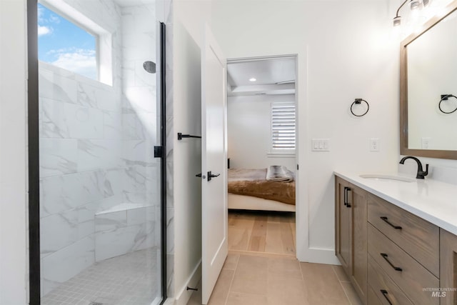 bathroom with tile patterned floors, vanity, and an enclosed shower