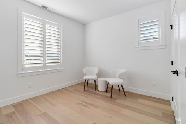 sitting room with light hardwood / wood-style floors