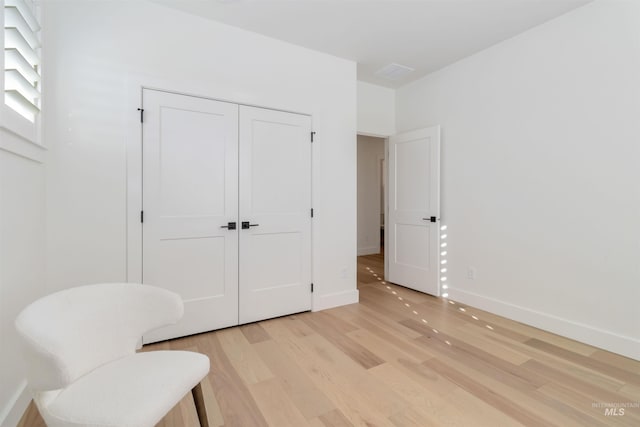 sitting room with light wood-type flooring