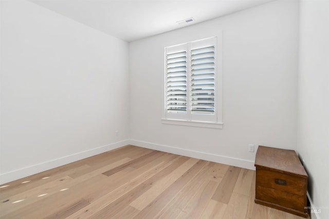 unfurnished room with light hardwood / wood-style floors