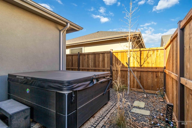 view of patio with a hot tub